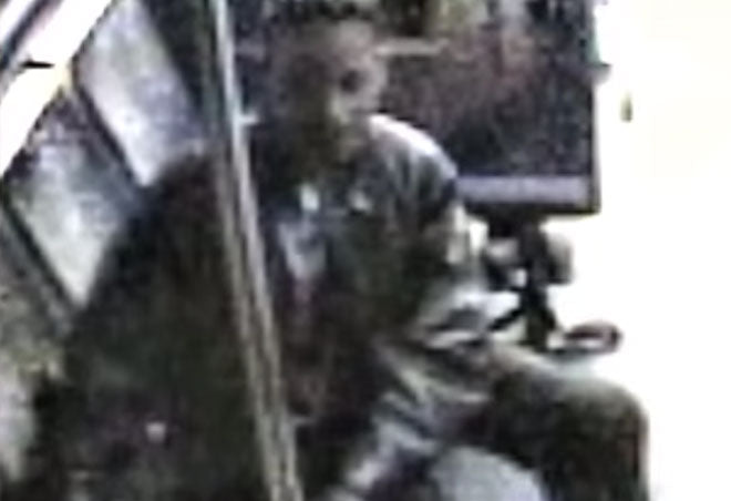 Forensic software enhancement of man on bus.