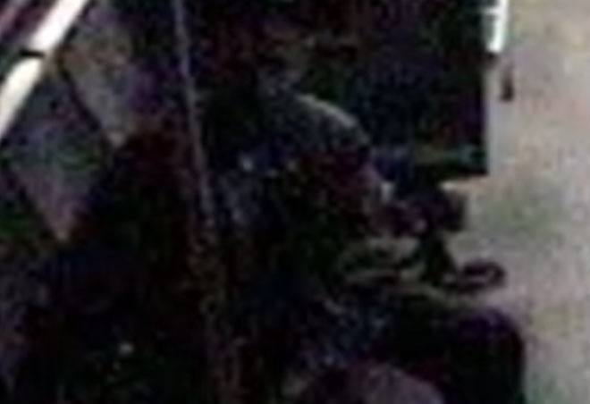 Forensic software enhancement of man on bus.