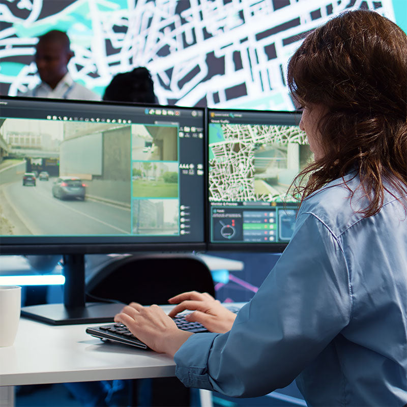 Woman working with video surveillance software.