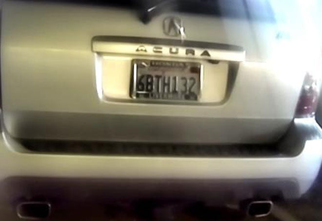 Blurry vehicle with license plate enhanced.
