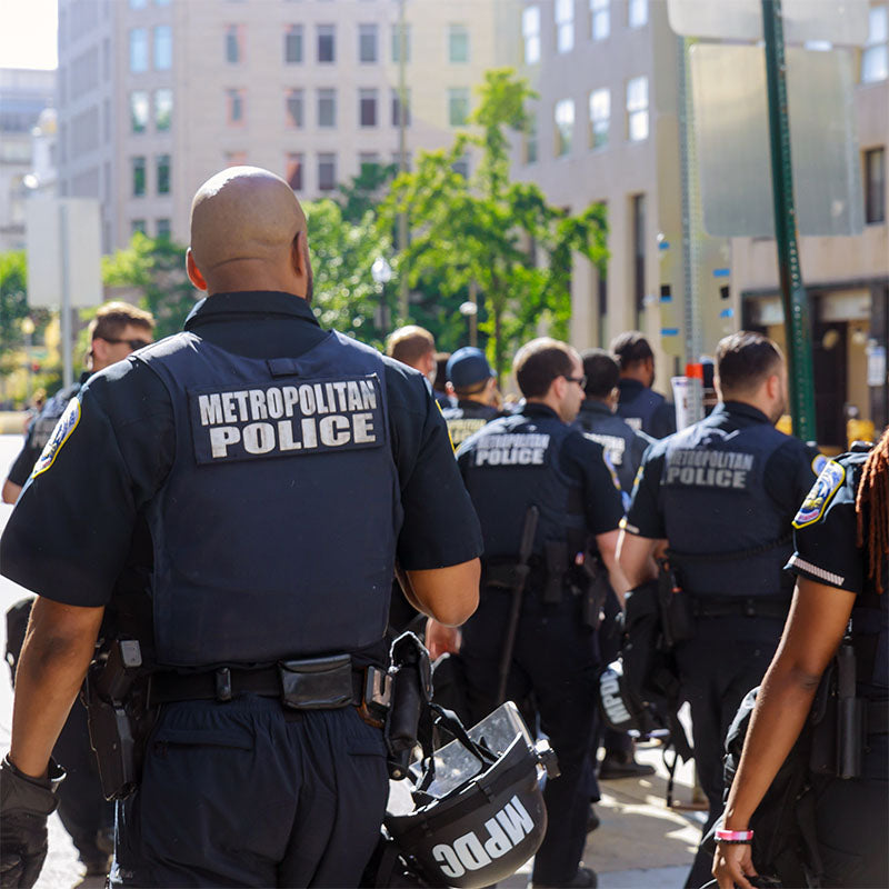 Police officers in crowd.