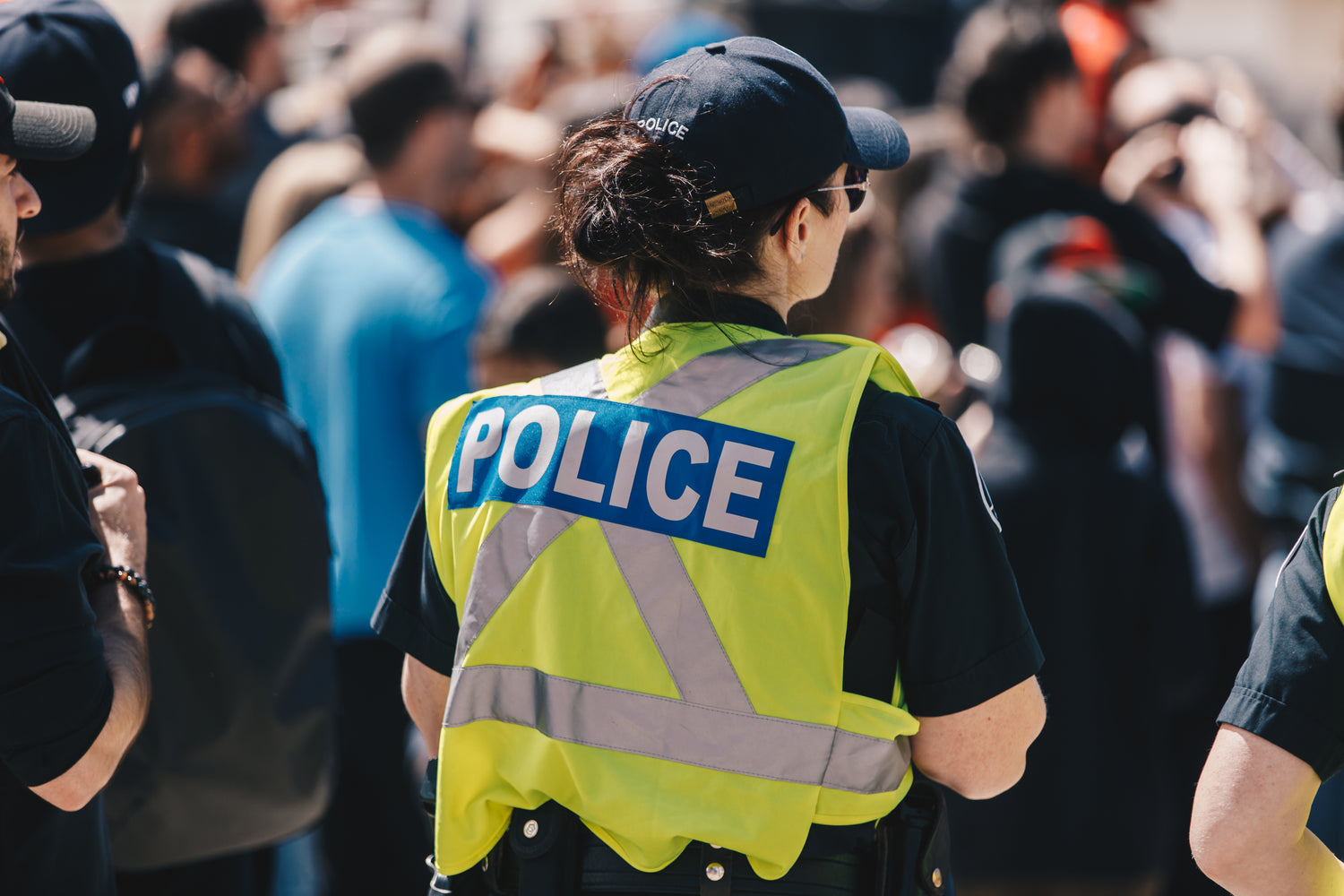 Police officer in crowd.